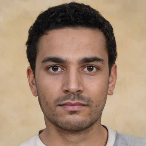 Neutral white young-adult male with short  black hair and brown eyes