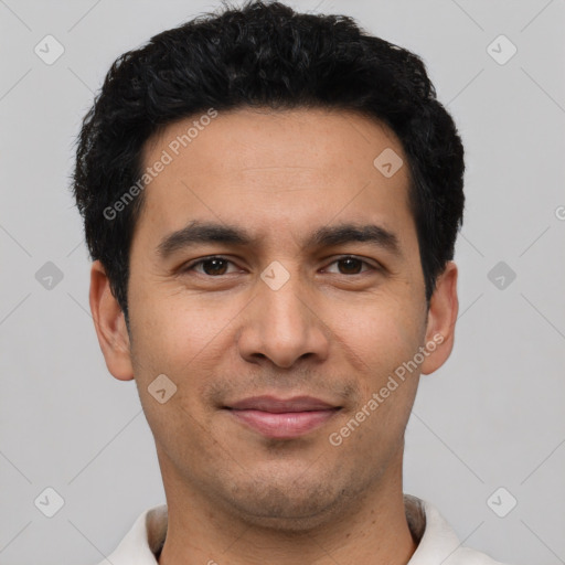 Joyful latino young-adult male with short  black hair and brown eyes