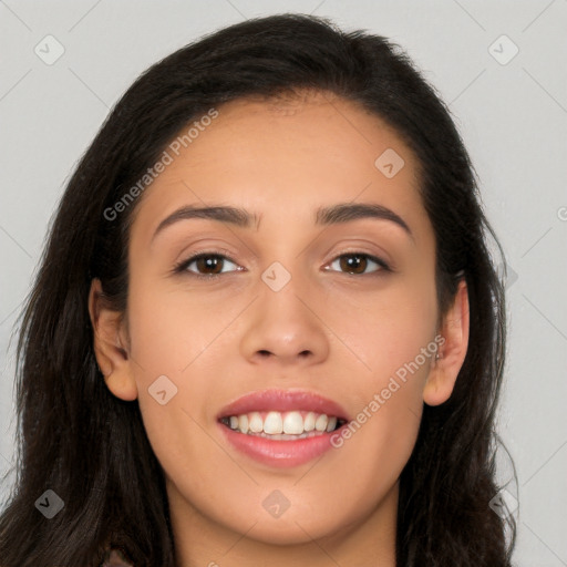 Joyful latino young-adult female with long  brown hair and brown eyes