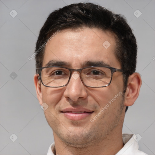 Joyful white adult male with short  brown hair and brown eyes