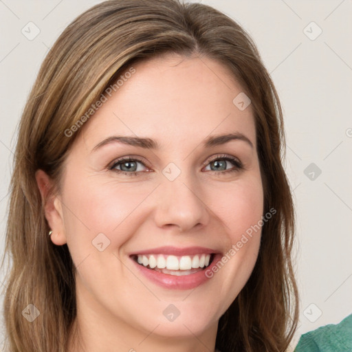 Joyful white young-adult female with medium  brown hair and green eyes