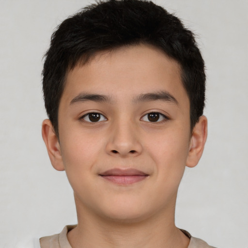 Joyful white child male with short  brown hair and brown eyes