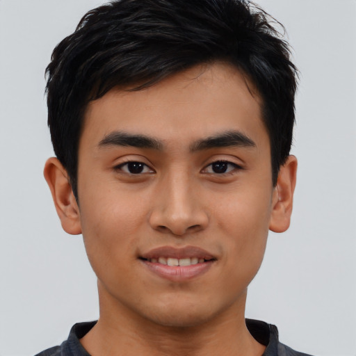 Joyful asian young-adult male with short  black hair and brown eyes