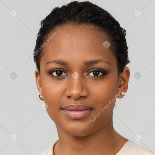 Joyful black young-adult female with short  black hair and brown eyes