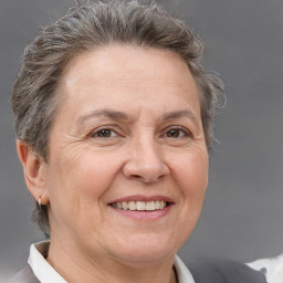 Joyful white middle-aged female with short  brown hair and brown eyes