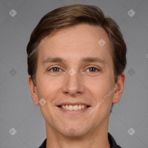 Joyful white adult male with short  brown hair and grey eyes