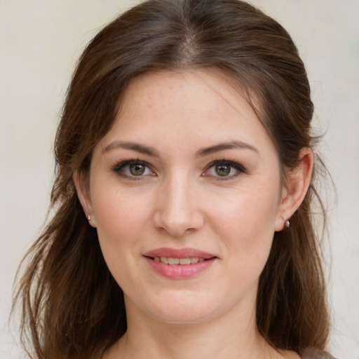 Joyful white young-adult female with medium  brown hair and grey eyes