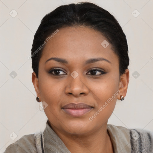 Joyful black young-adult female with short  black hair and brown eyes