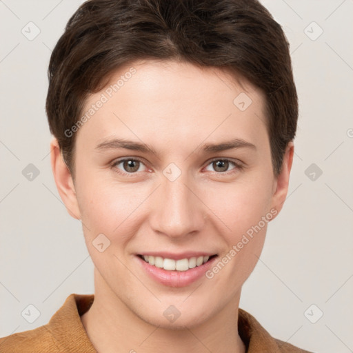 Joyful white young-adult female with short  brown hair and brown eyes