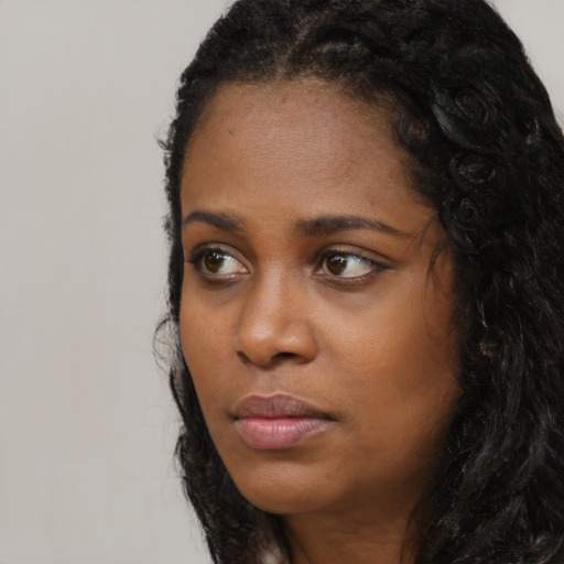 Neutral black young-adult female with long  black hair and brown eyes