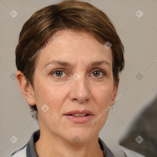 Joyful white adult female with short  brown hair and grey eyes