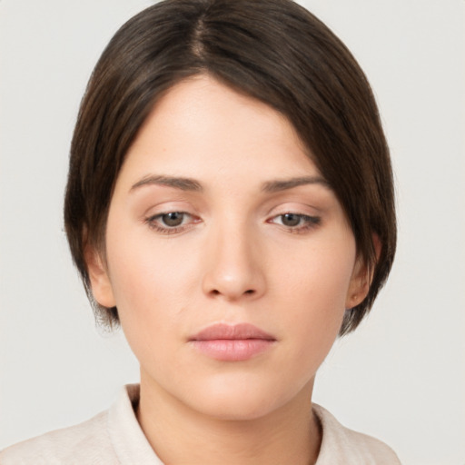 Neutral white young-adult female with medium  brown hair and brown eyes