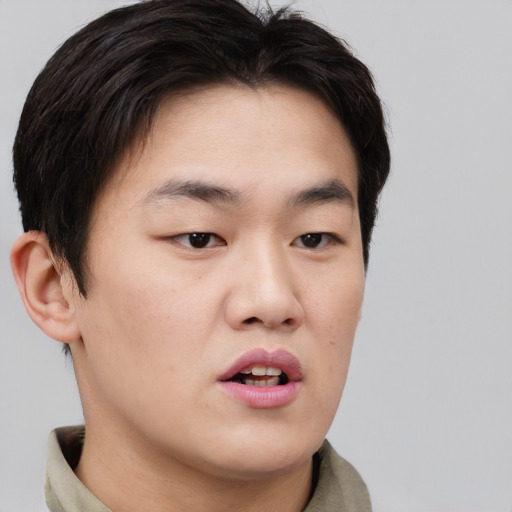 Neutral asian young-adult male with short  brown hair and brown eyes