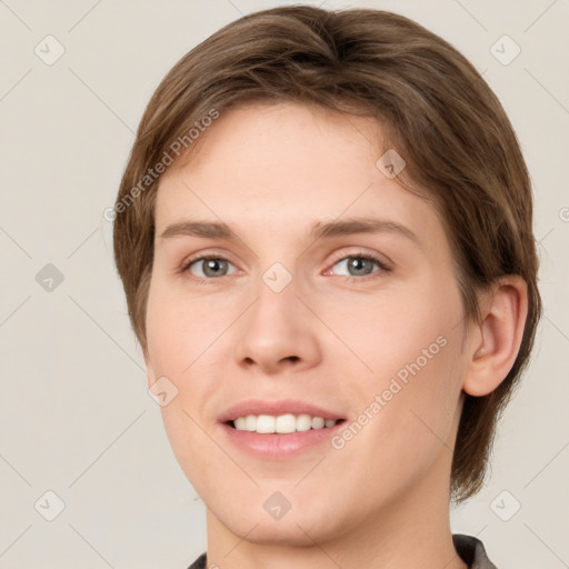 Joyful white young-adult female with medium  brown hair and green eyes