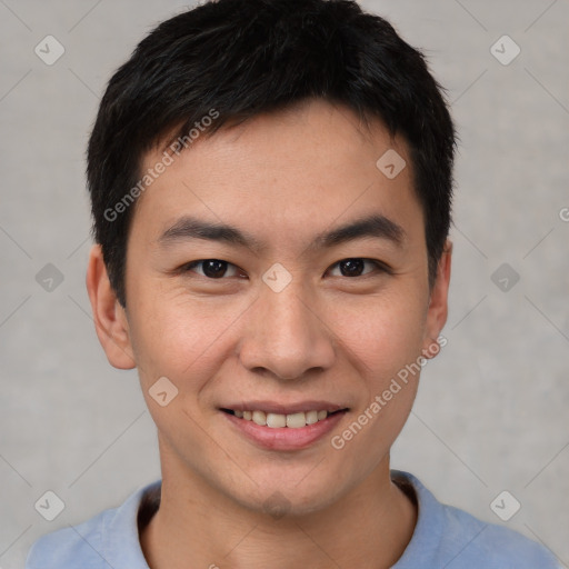 Joyful asian young-adult male with short  brown hair and brown eyes