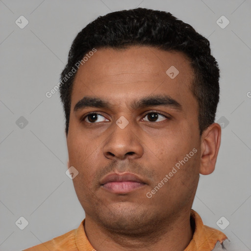 Neutral latino young-adult male with short  black hair and brown eyes