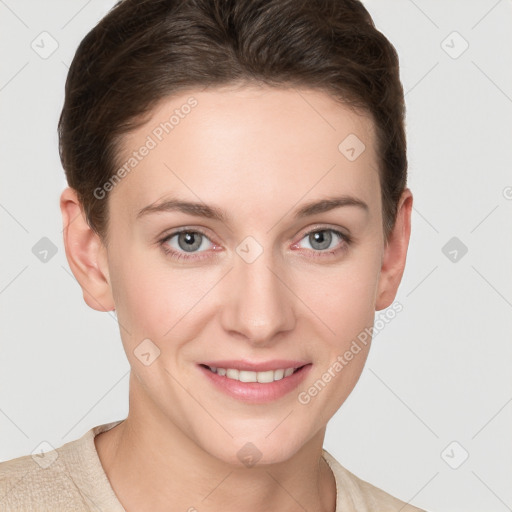 Joyful white young-adult female with short  brown hair and grey eyes