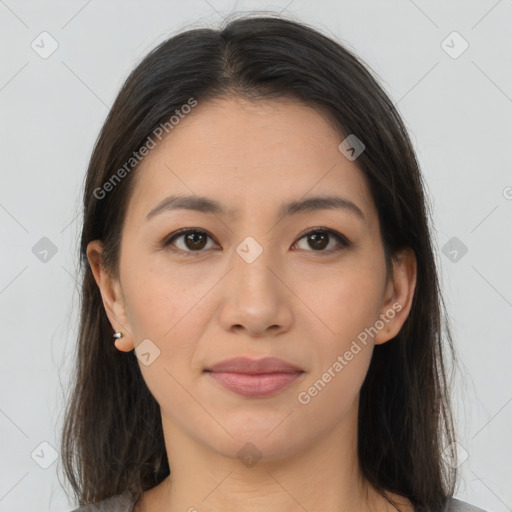 Joyful asian young-adult female with long  brown hair and brown eyes