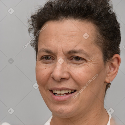 Joyful white adult female with short  brown hair and brown eyes