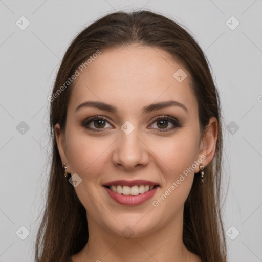 Joyful white young-adult female with long  brown hair and grey eyes