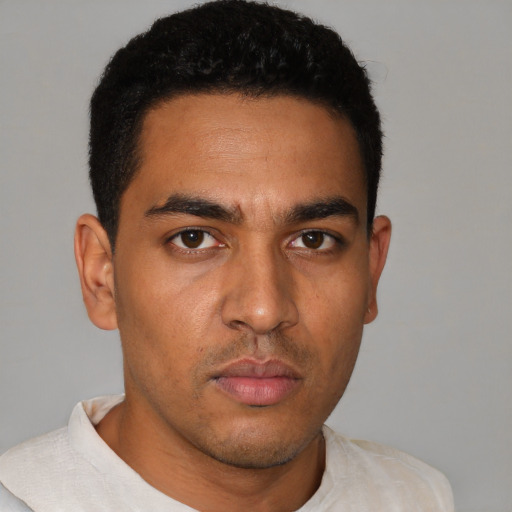 Neutral latino young-adult male with short  black hair and brown eyes