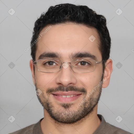 Joyful white young-adult male with short  black hair and brown eyes