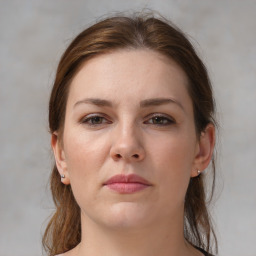 Neutral white young-adult female with medium  brown hair and brown eyes