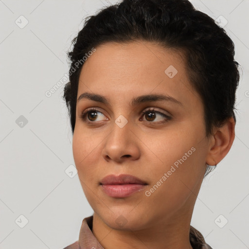 Joyful latino young-adult female with short  black hair and brown eyes