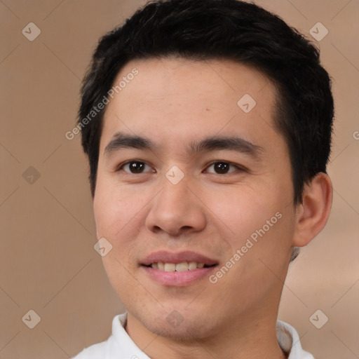 Joyful white young-adult male with short  black hair and brown eyes