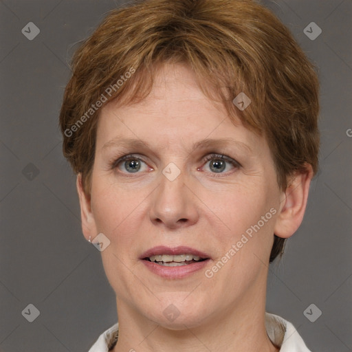 Joyful white adult female with short  brown hair and grey eyes