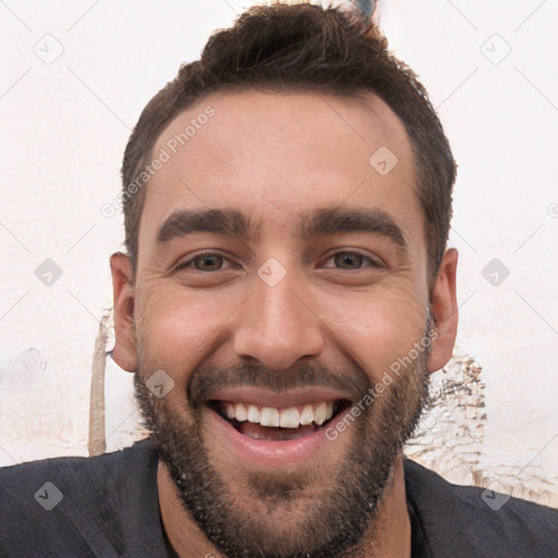 Joyful white young-adult male with short  black hair and brown eyes