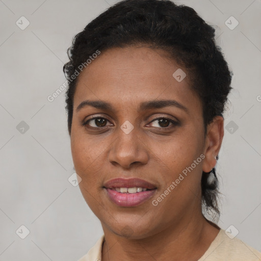 Joyful black young-adult female with short  brown hair and brown eyes