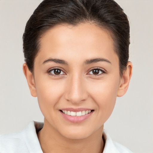 Joyful white young-adult female with medium  brown hair and brown eyes