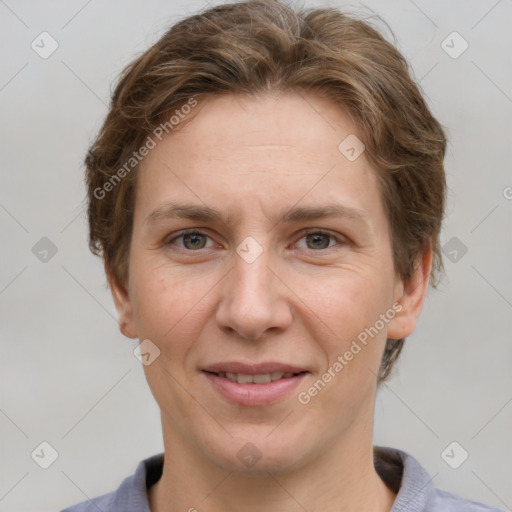 Joyful white adult female with short  brown hair and grey eyes