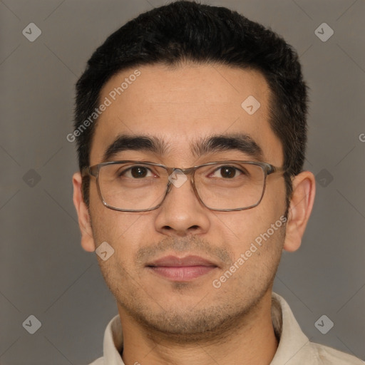 Joyful white adult male with short  black hair and brown eyes