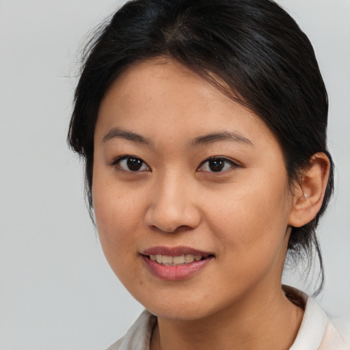 Joyful asian young-adult female with medium  brown hair and brown eyes