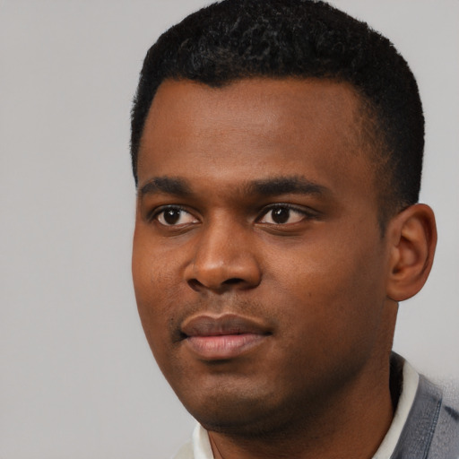 Neutral black young-adult male with short  black hair and brown eyes