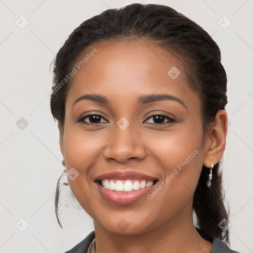 Joyful latino young-adult female with long  brown hair and brown eyes