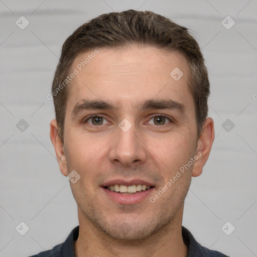 Joyful white young-adult male with short  brown hair and grey eyes