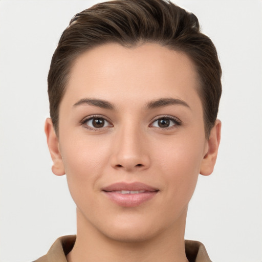 Joyful white young-adult female with short  brown hair and brown eyes