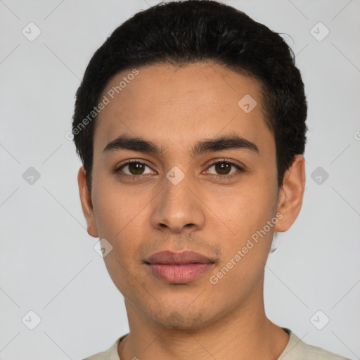 Joyful latino young-adult male with short  black hair and brown eyes