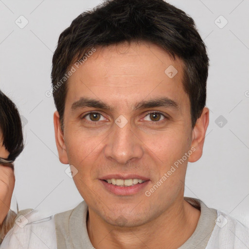 Joyful white young-adult male with short  brown hair and brown eyes