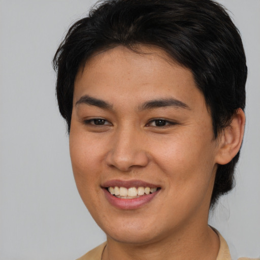 Joyful asian young-adult female with medium  brown hair and brown eyes