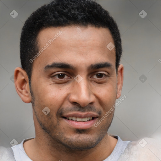 Joyful latino young-adult male with short  brown hair and brown eyes