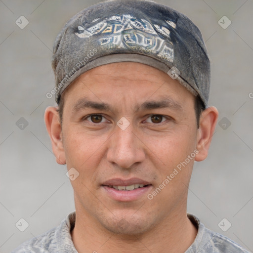 Joyful white adult male with short  brown hair and grey eyes