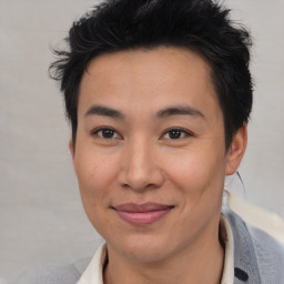 Joyful asian young-adult male with short  brown hair and brown eyes