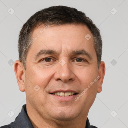 Joyful white adult male with short  brown hair and brown eyes