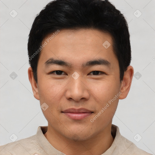 Joyful asian young-adult male with short  brown hair and brown eyes