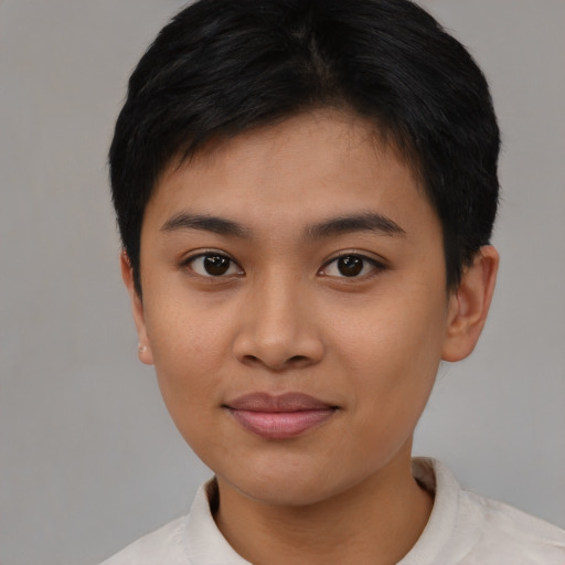 Joyful asian young-adult female with short  brown hair and brown eyes