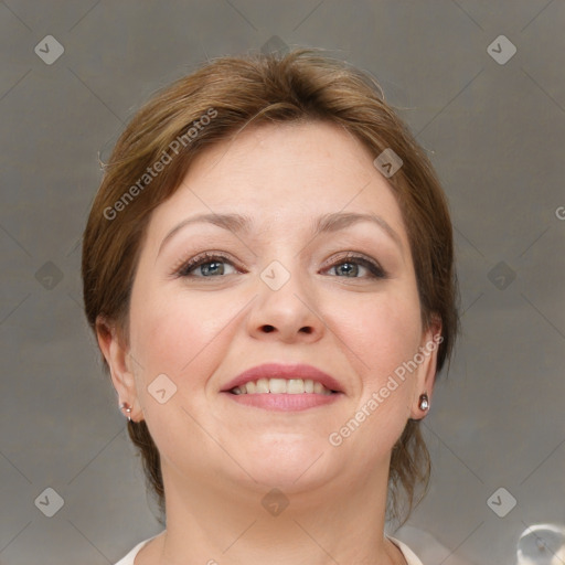 Joyful white adult female with medium  brown hair and grey eyes